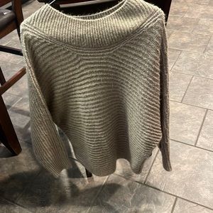 Say what large poncho type sweater!